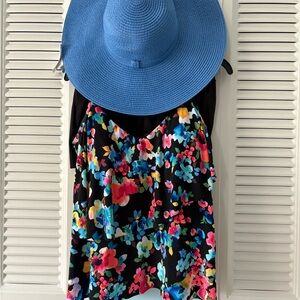 Pretty tankini. Small skirted bottom. Large ruffled top with adj straps. NWT hat